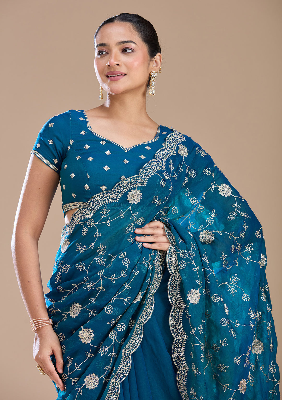 Peacock Blue Georgette Gold Zariwork Saree With Matching Blouse Piece