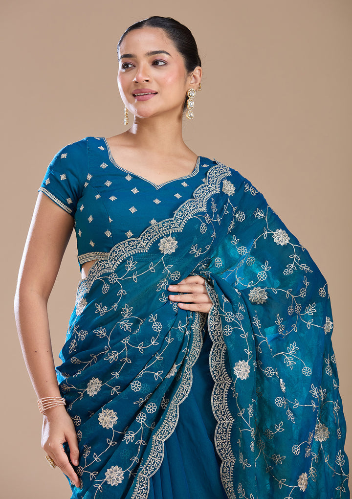 Peacock Blue Georgette Gold Zariwork Saree With Matching Blouse Piece