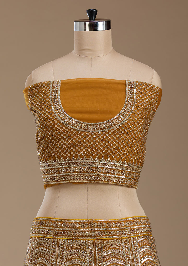 Koskii Net Golden Lehenga – Luxurious Zari Embroidery