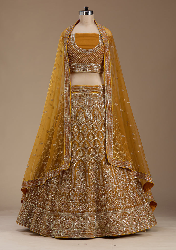 Koskii Net Golden Lehenga – Luxurious Zari Embroidery