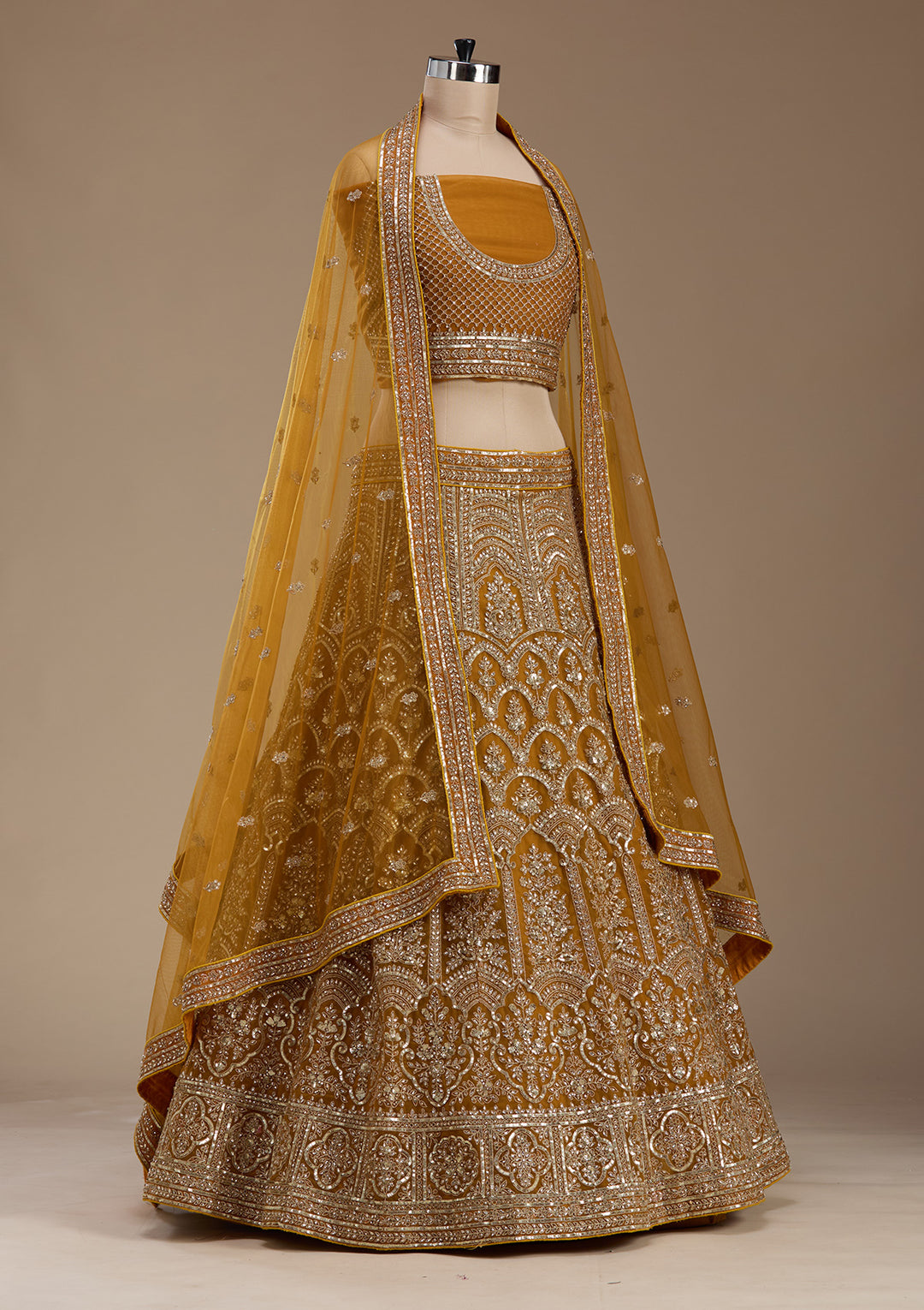 Koskii Net Golden Lehenga – Luxurious Zari Embroidery