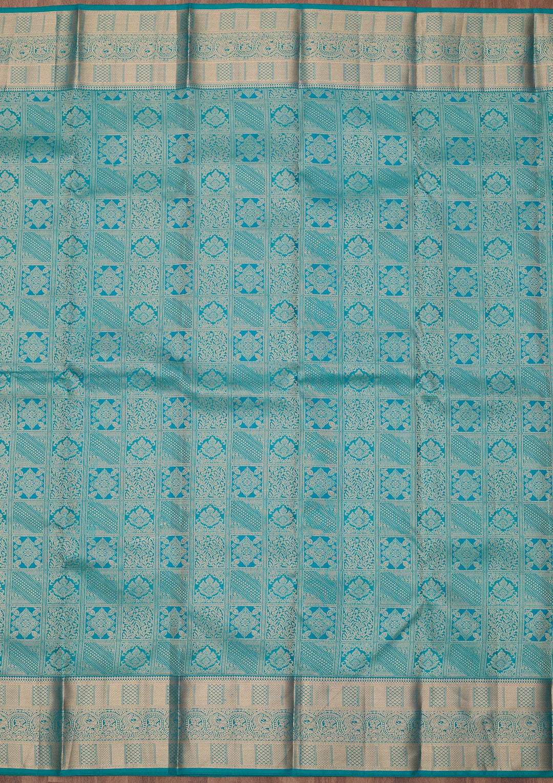Peacock Blue Silk Jaal Gold Zariwork Saree With Matching Blouse Piece