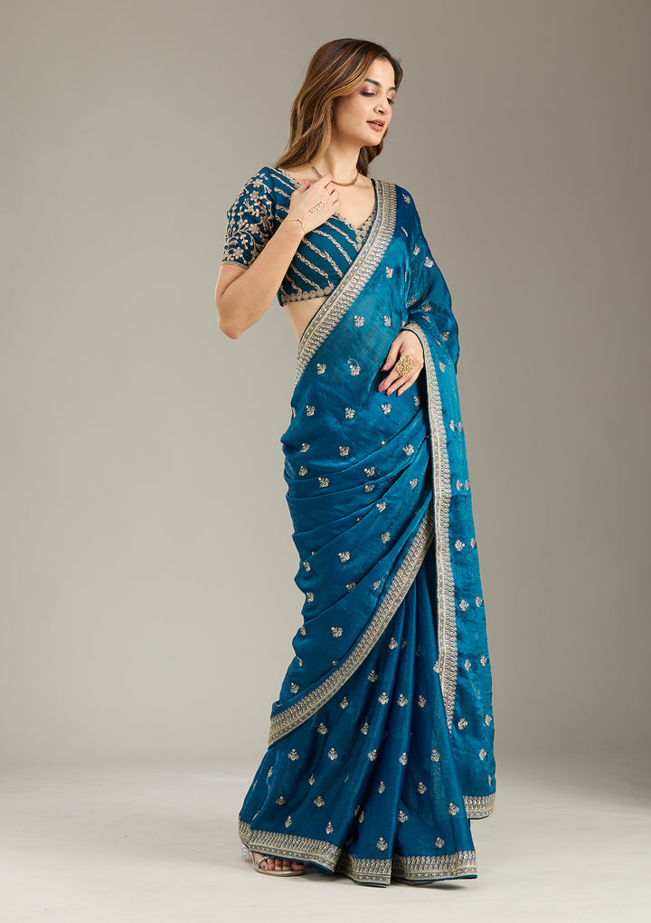 Peacock Blue Tissue Gold Zariwork Saree With Matching Blouse Piece