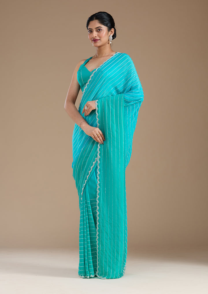 Blue Satin Cutdana Saree With Matching Blouse Piece