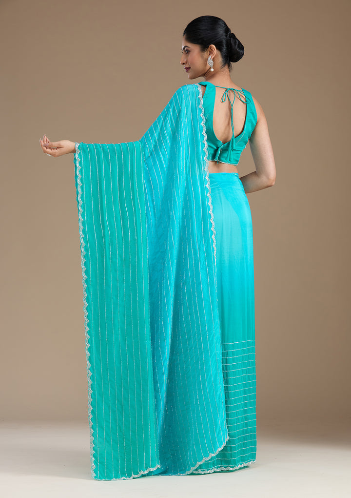 Blue Satin Cutdana Saree With Matching Blouse Piece