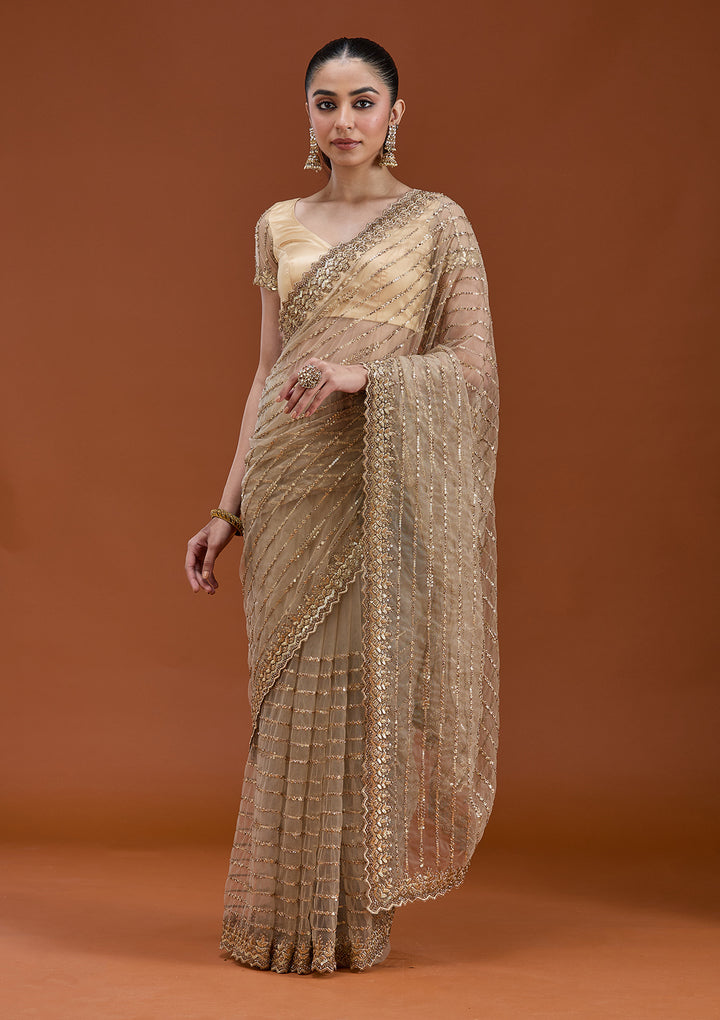 Beige Net Sequins Saree With Matching Blouse Piece