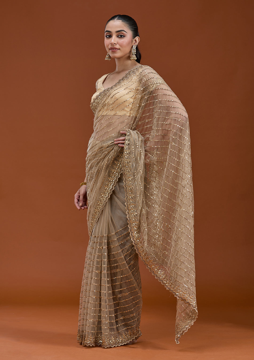 Beige Net Sequins Saree With Matching Blouse Piece