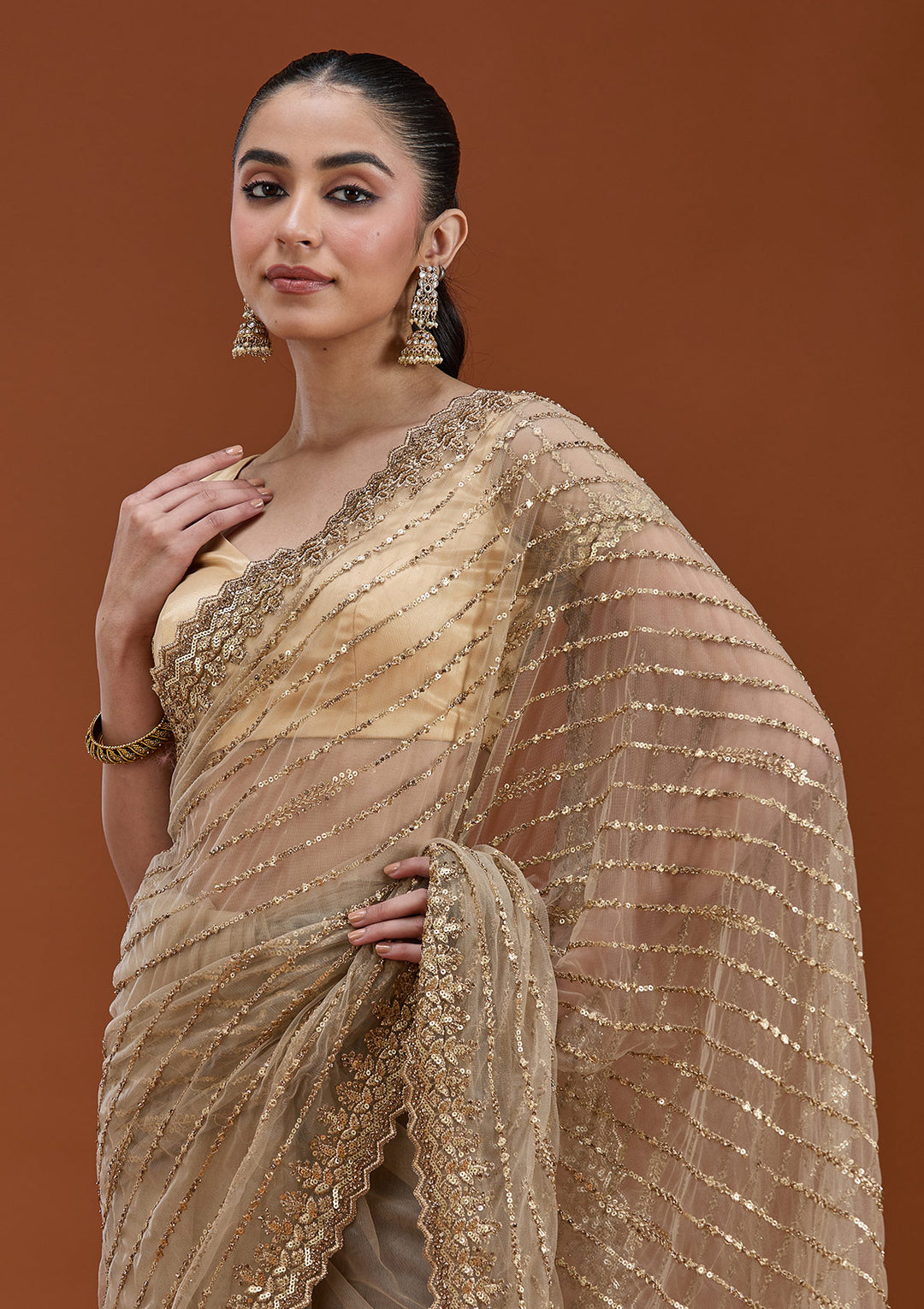 Beige Net Sequins Saree With Matching Blouse Piece