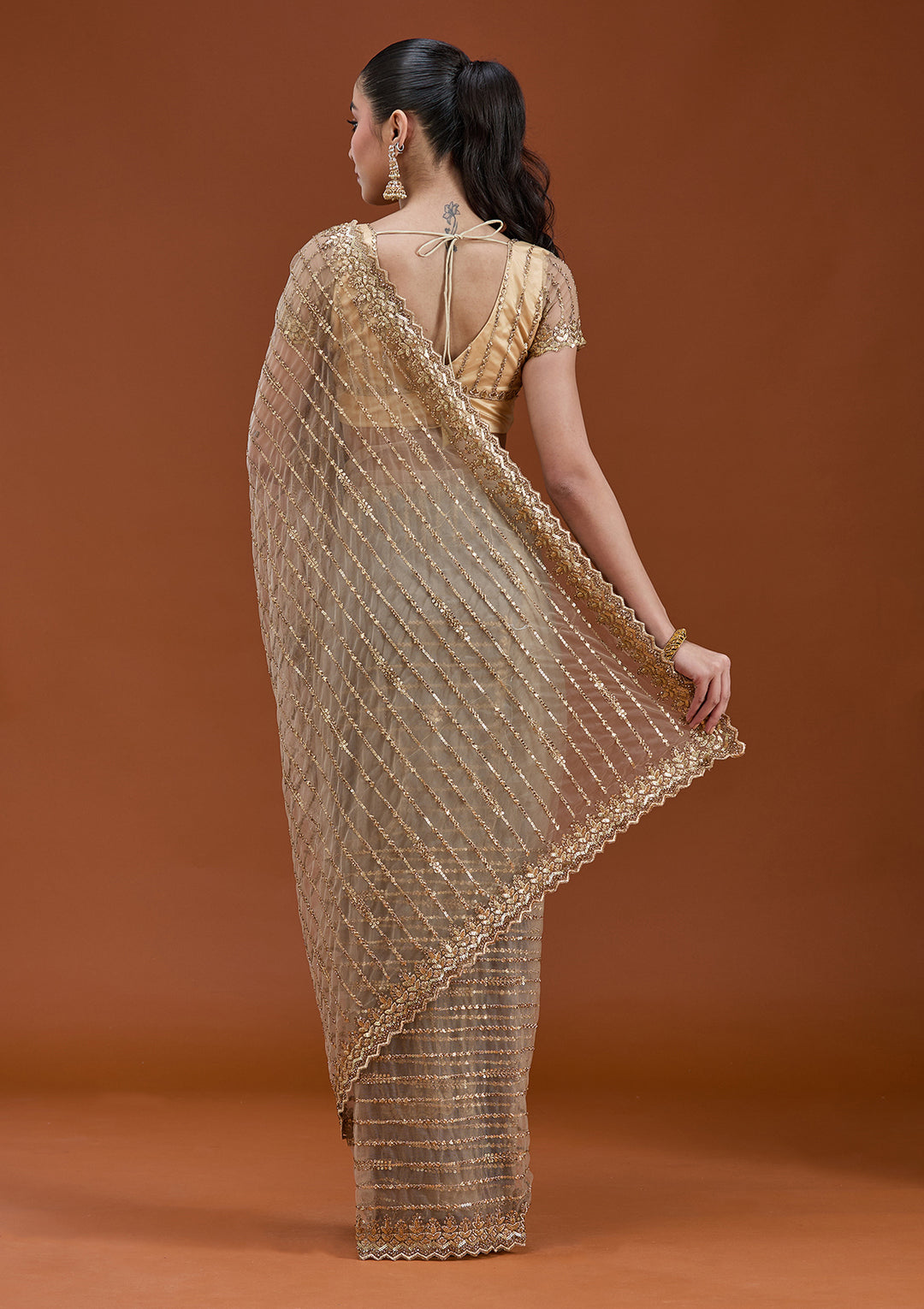 Beige Net Sequins Saree With Matching Blouse Piece