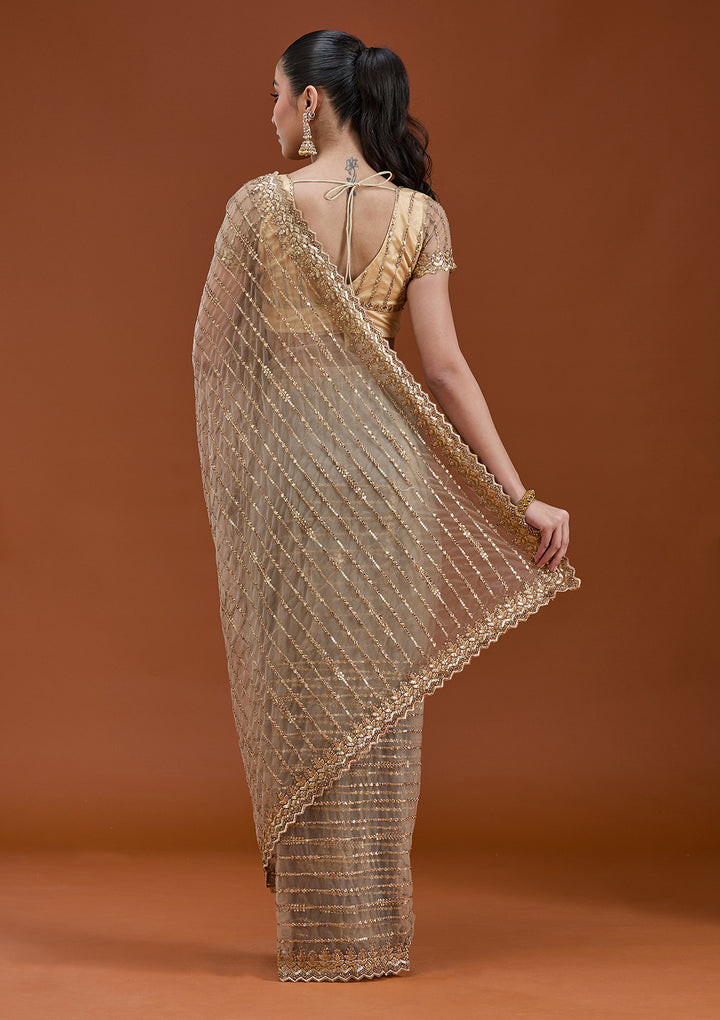 Beige Net Sequins Saree With Matching Blouse Piece