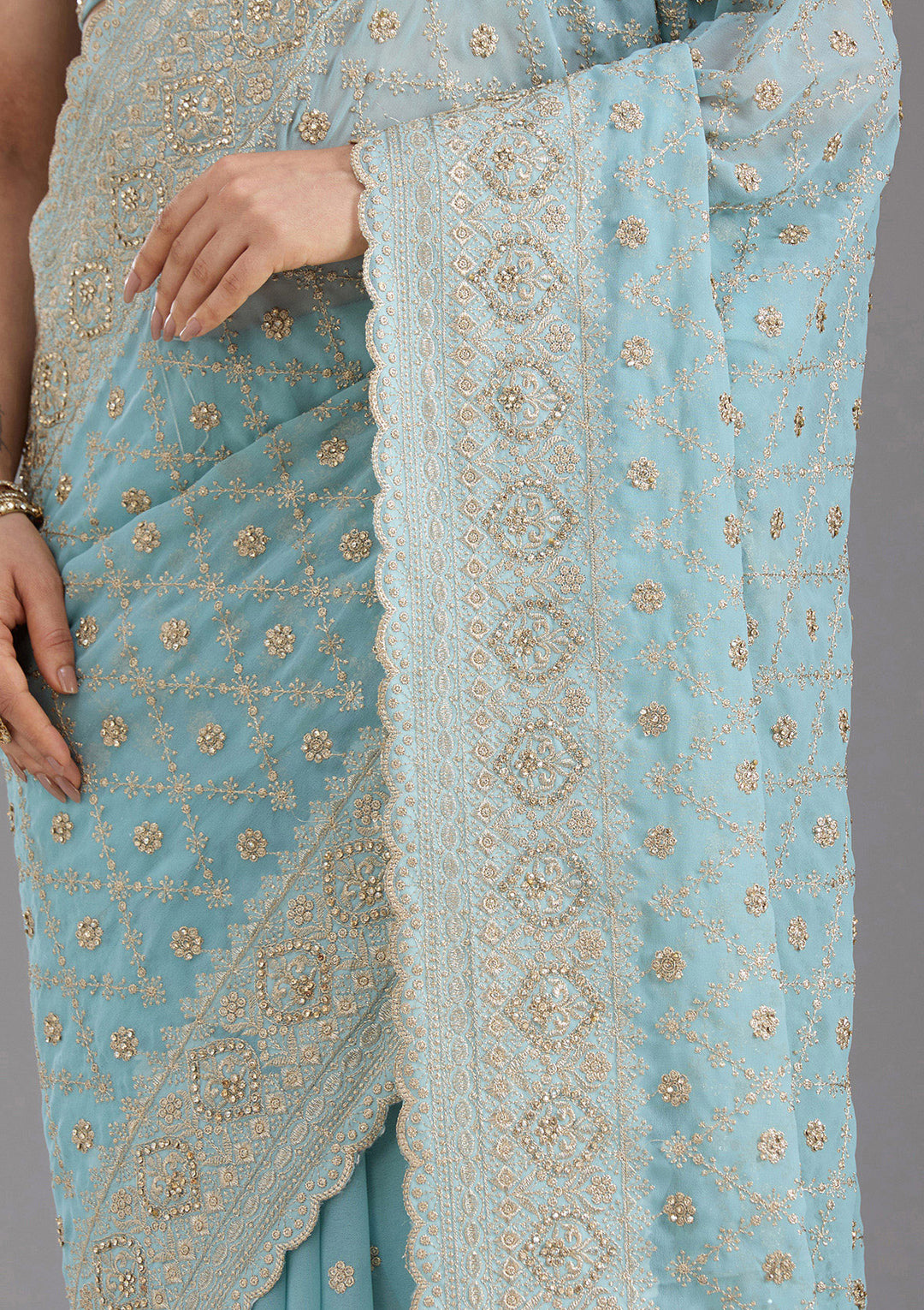 Sky Blue Georgette Gold Zariwork Saree With Matching Blouse Piece