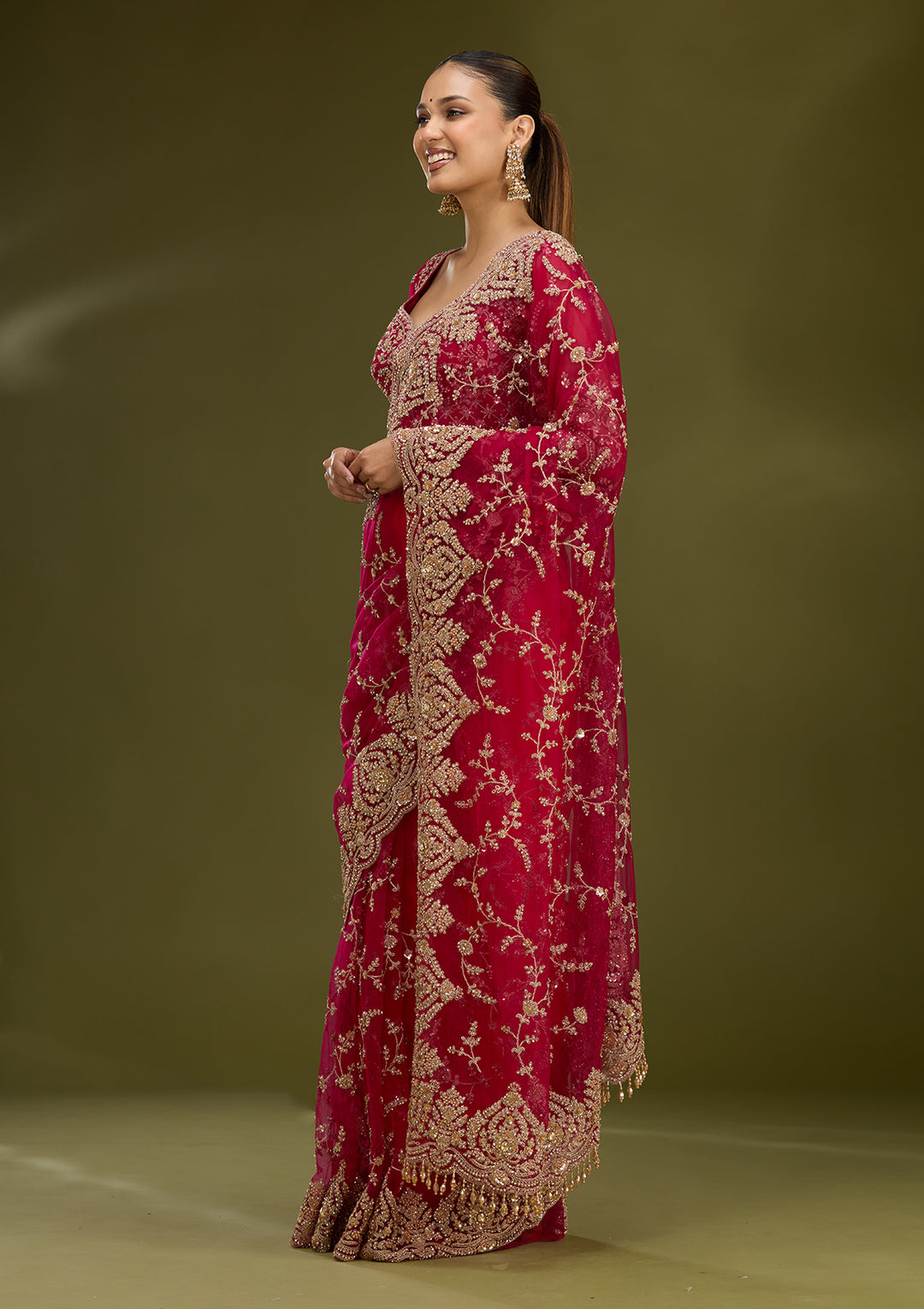 Rani Pink Net Gold Zariwork Saree With Matching Blouse Piece