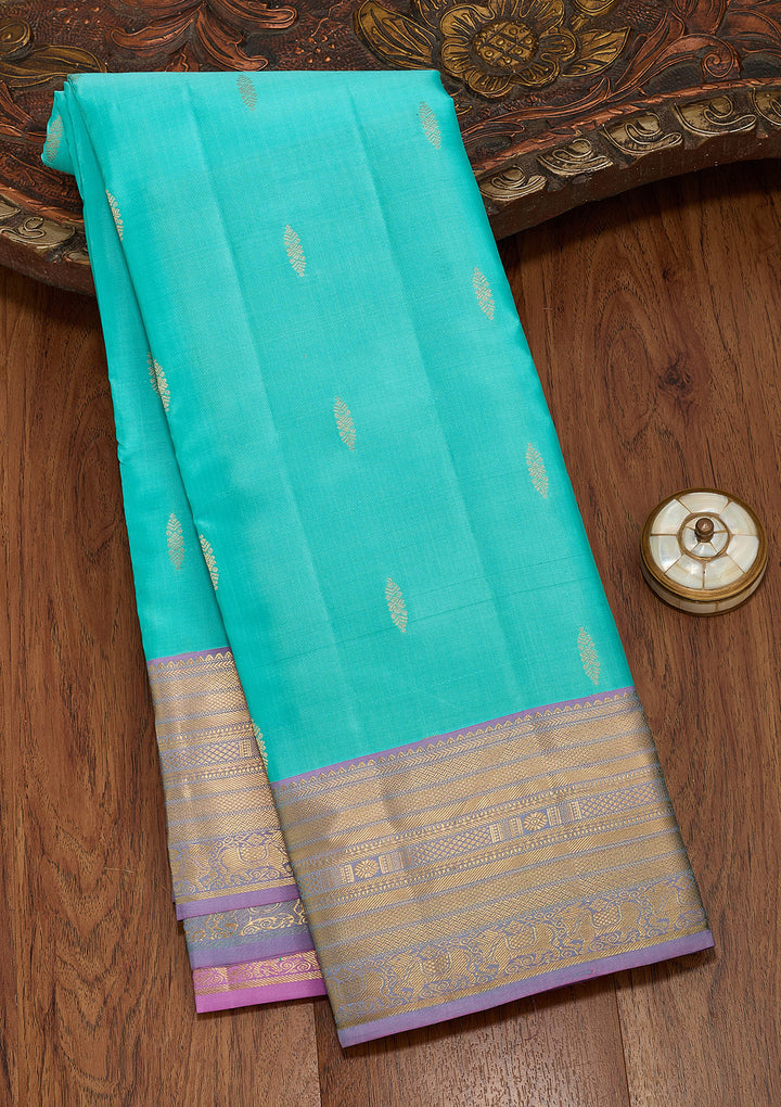 Turquoise Blue Silk Buti Saree With Matching Blouse Piece