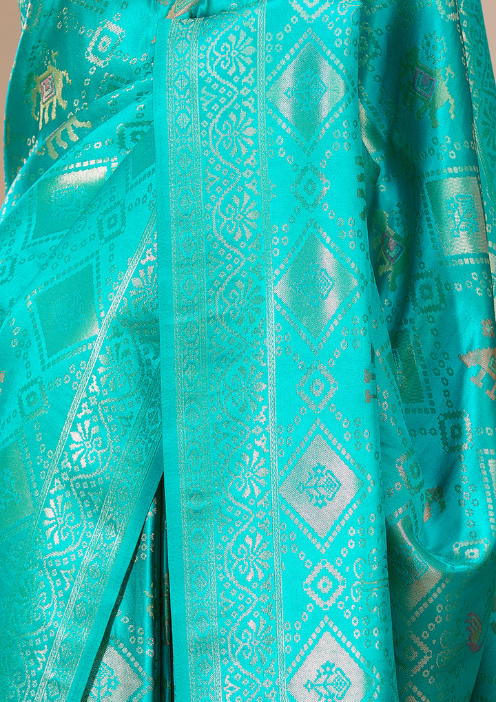 Turquoise Blue Patola Art Silk Saree With Matching Blouse Piece