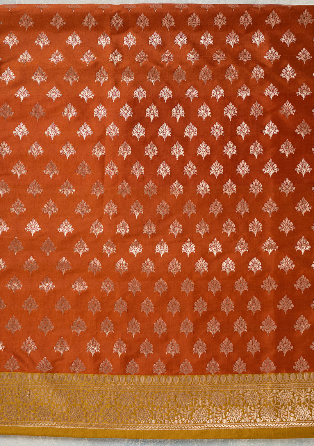 Rust Mustard Yellow Silk Bandhej Gold Zariwork Unstitched Dress Material With Matching Bottom And Dupatta
