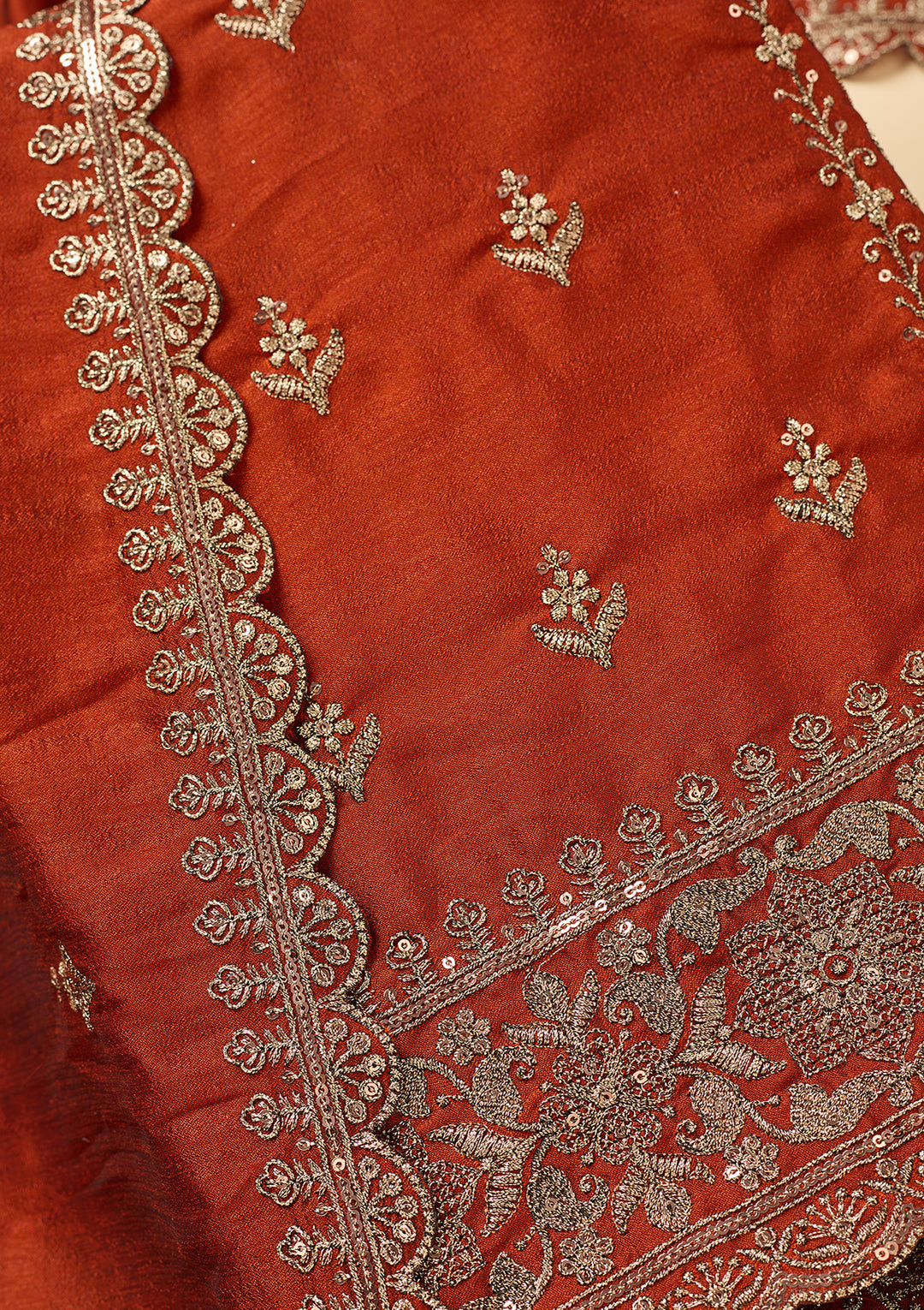 Rust Soft Raw Silk Antique Zardozi Unstitched Dress Material With Matching Bottom And Dupatta