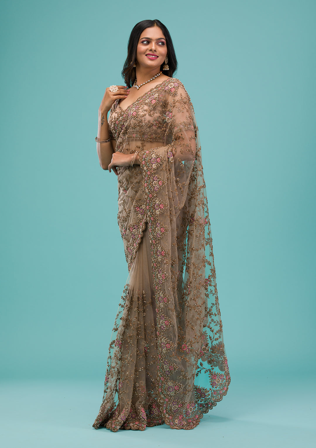 Beige Net Gold Zariwork Saree With Matching Blouse Piece