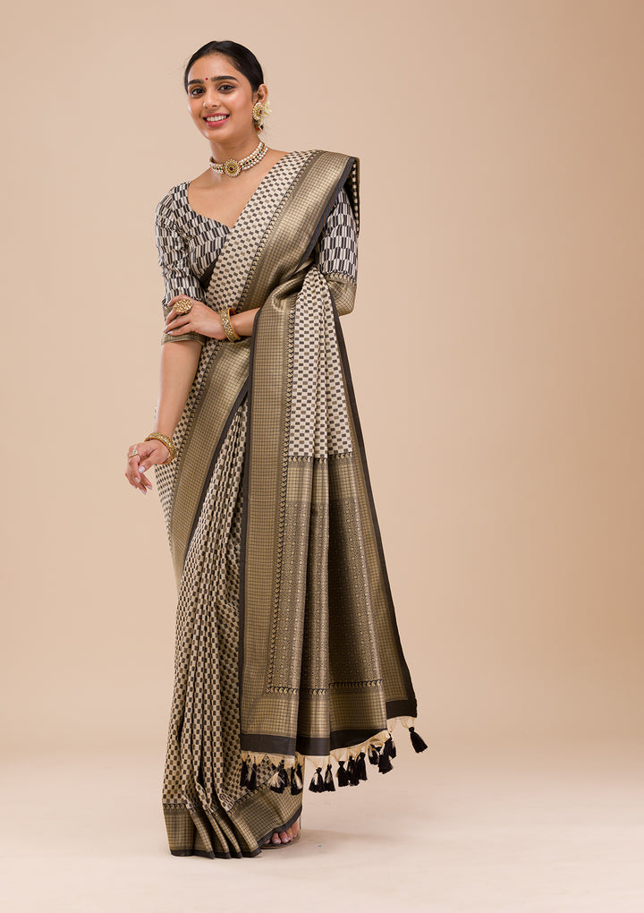 Koskii Orange Saree with Exquisite Threadwork – Traditional Elegance