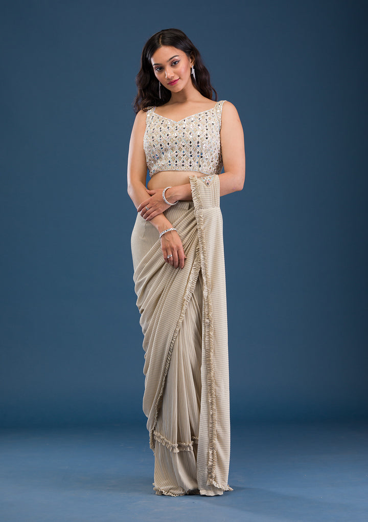 Koskii Beige Georgette Saree with Mirrorwork – Elegant Evening Wear