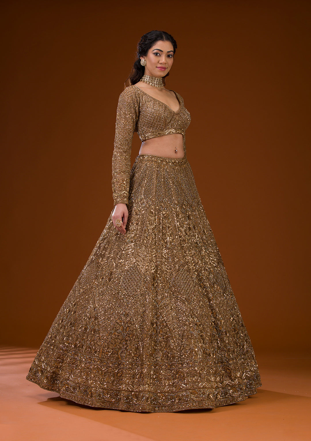 Koskii Net Gold Lehenga – Embellished with Exquisite Stonework
