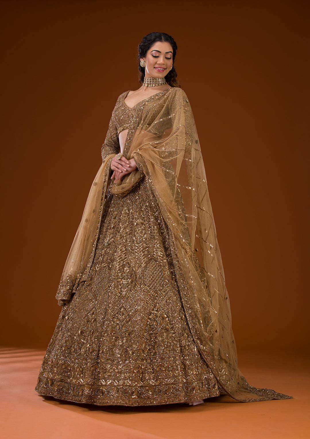 Koskii Net Gold Lehenga – Embellished with Exquisite Stonework