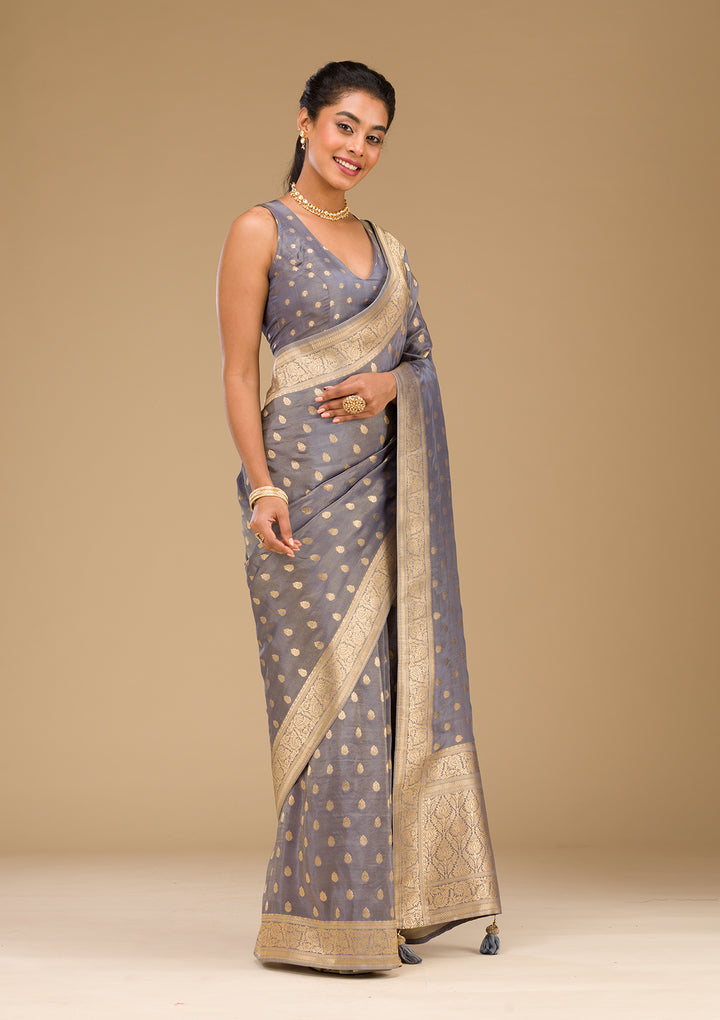 Koskii Orange Saree with Exquisite Threadwork – Traditional Elegance