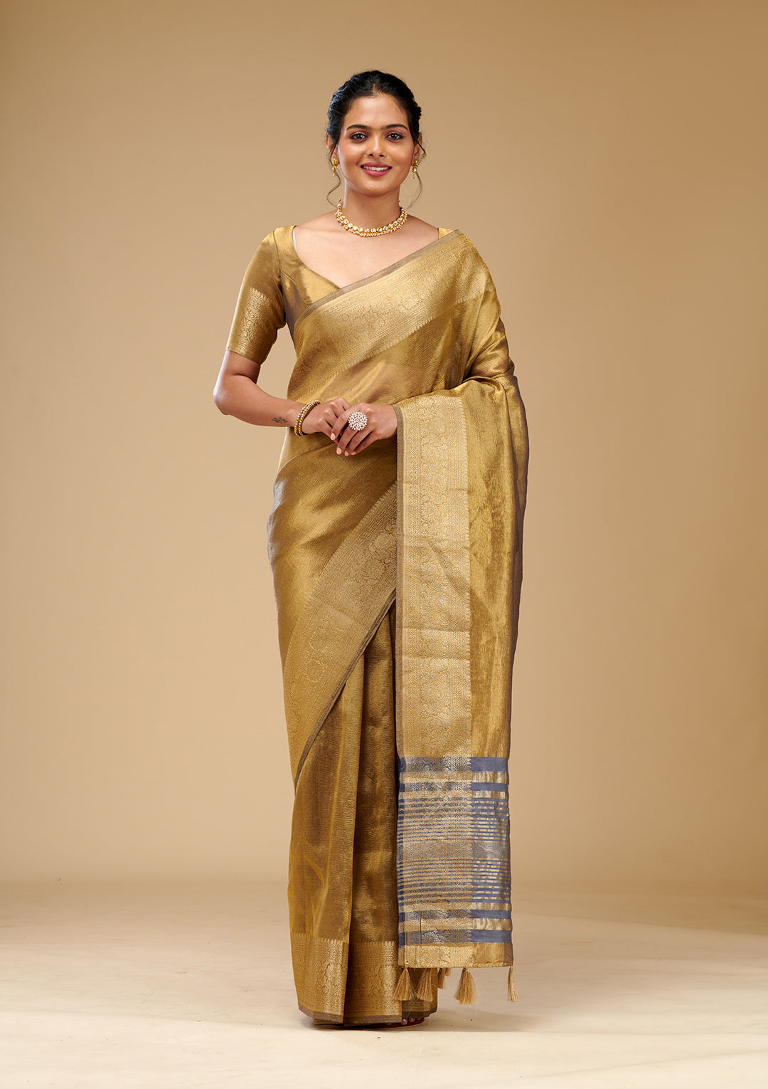 Koskii Gold Tissue Saree with Zariwork – Elegant Evening Wear