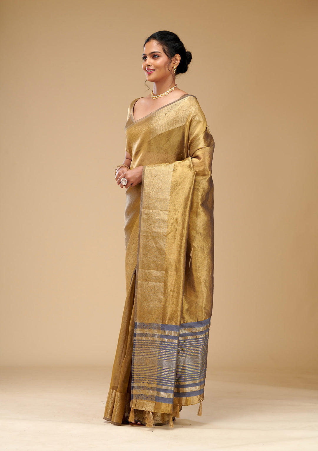 Koskii Gold Tissue Saree with Zariwork – Elegant Evening Wear
