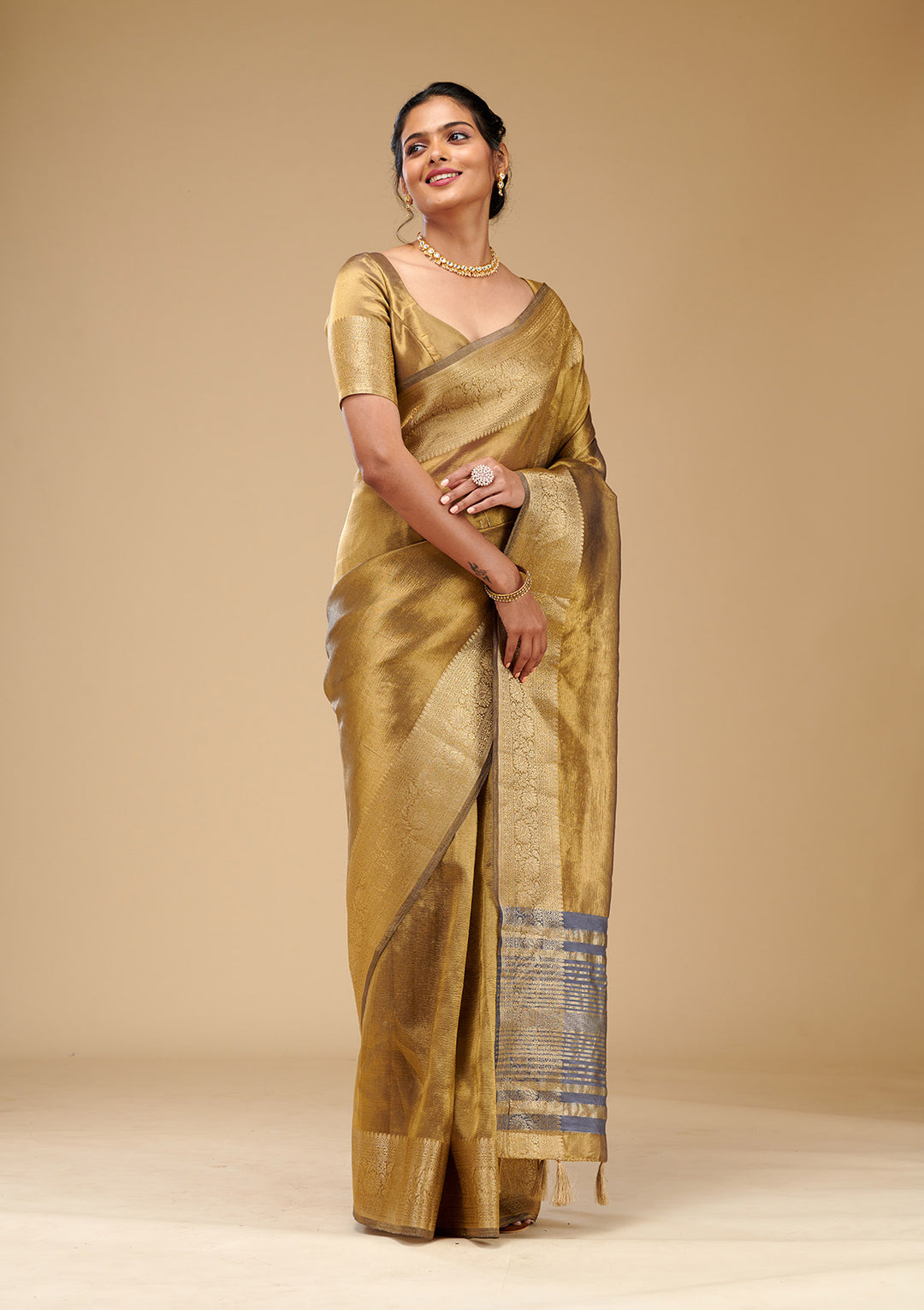 Koskii Gold Tissue Saree with Zariwork – Elegant Evening Wear
