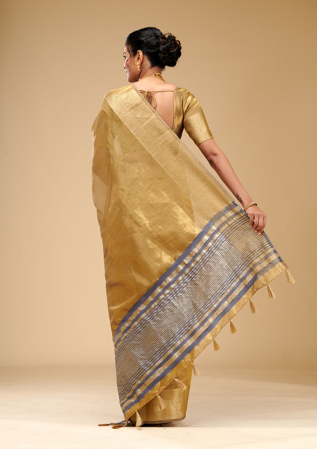Koskii Gold Tissue Saree with Zariwork – Elegant Evening Wear