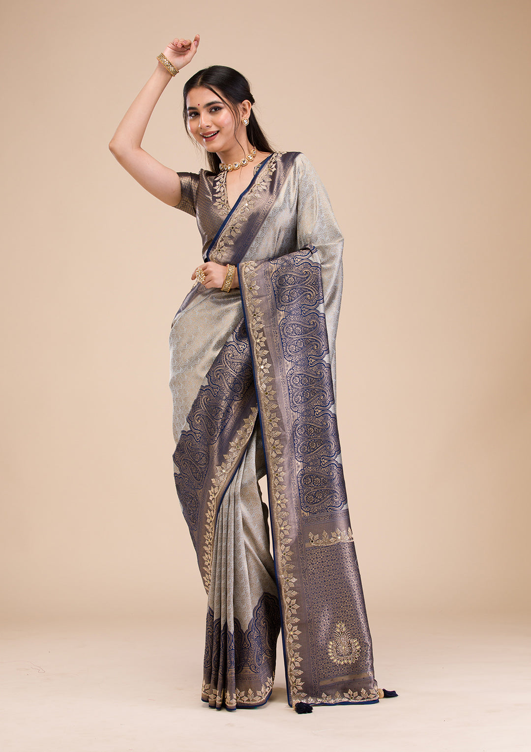 Koskii Orange Saree with Exquisite Threadwork – Traditional Elegance