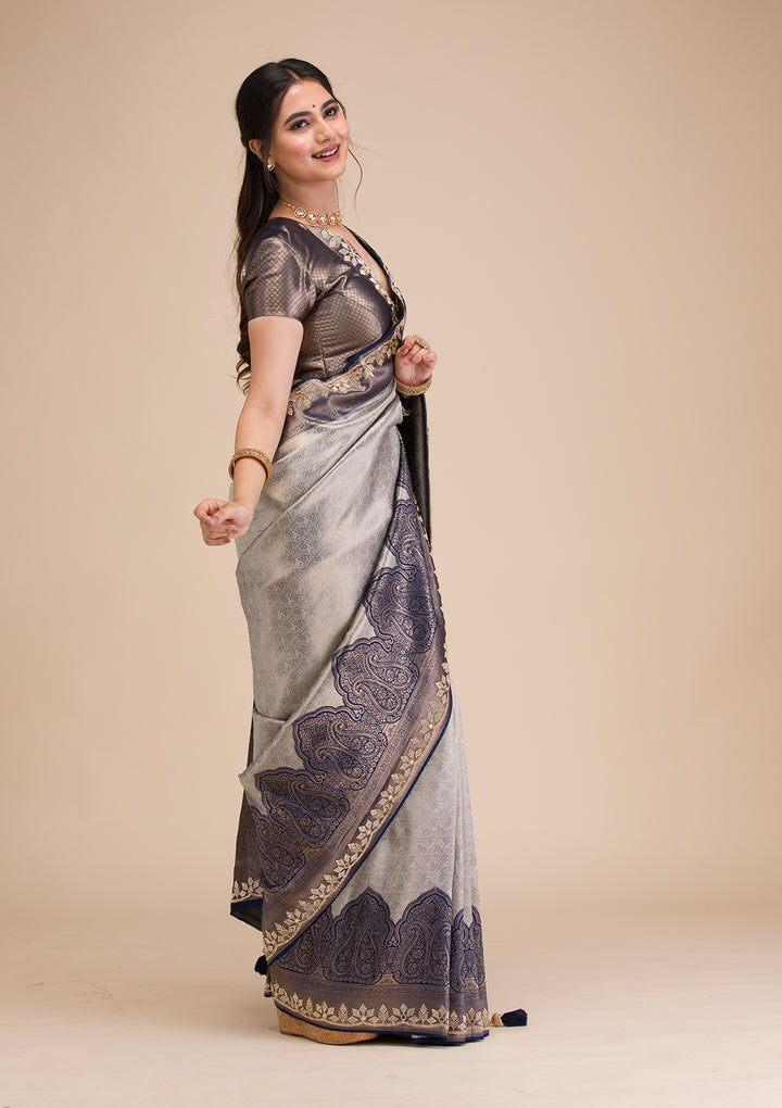 Koskii Orange Saree with Exquisite Threadwork – Traditional Elegance