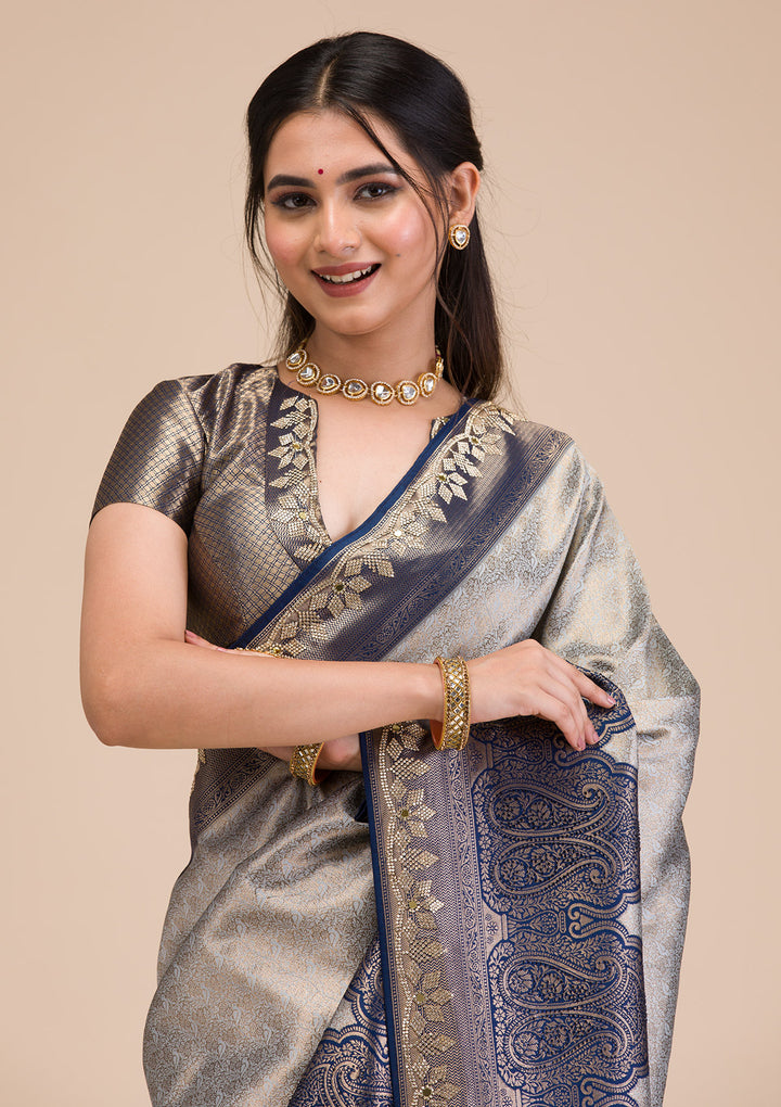 Koskii Orange Saree with Exquisite Threadwork – Traditional Elegance