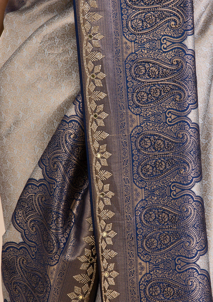 Koskii Orange Saree with Exquisite Threadwork – Traditional Elegance