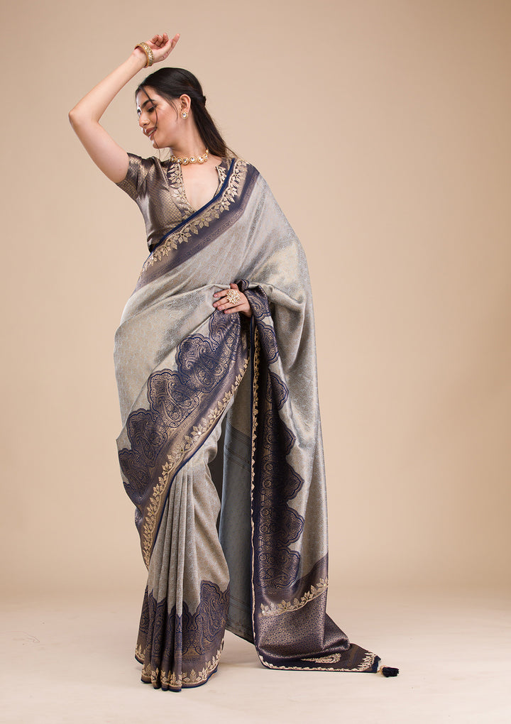 Koskii Orange Saree with Exquisite Threadwork – Traditional Elegance