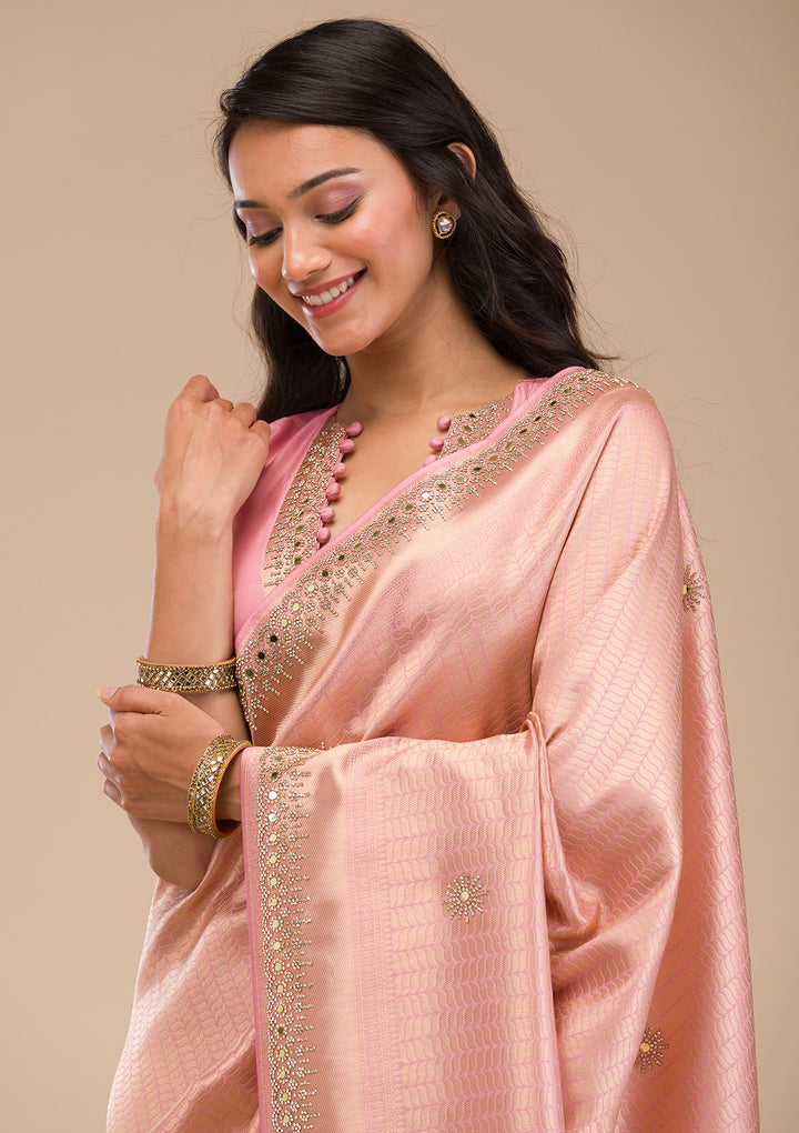 Koskii Orange Saree with Exquisite Threadwork – Traditional Elegance