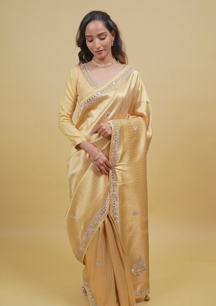 Koskii Orange Saree with Exquisite Threadwork – Traditional Elegance